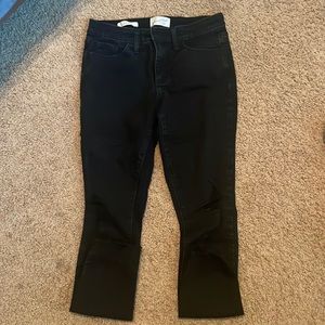 Black jean with holes , worn maybe 3 times, mid rise skinny jeans , black